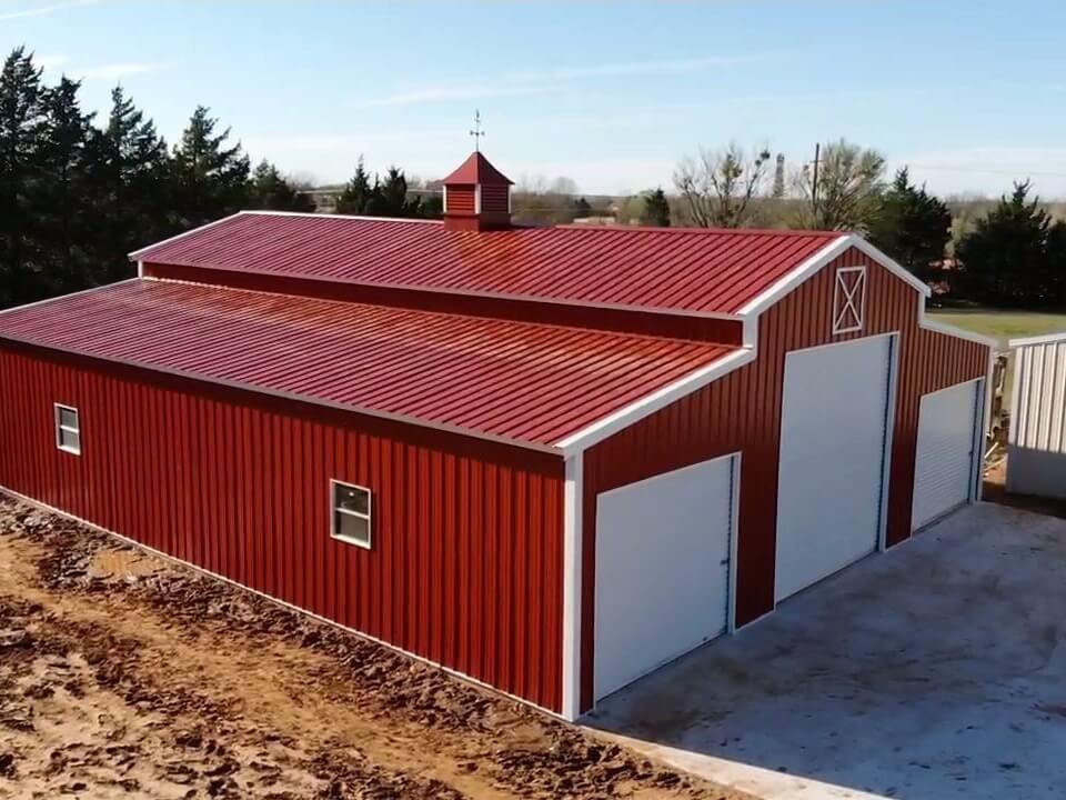 Big Red Metal Barn with Large White Doors