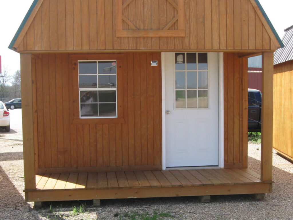 Shed with a door, windows, and a small porch